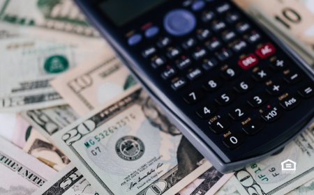 Calculator on top of cash.