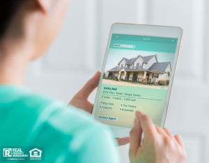 Woman on Tablet Looking at Manchaca Property Costs