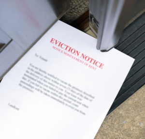 Eviction Notice Slipped Under an Open Door