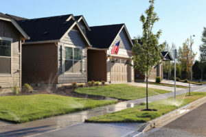 North Logan Rental Property Watering Their Lawn with Sprinkler System