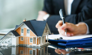 Signing Papers After the Purchase of an Investment Property in Wellsville