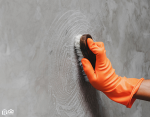 Scrubbing a Wall in a Hyde Park Rental Property