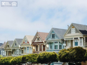 row of colorful houses on a street