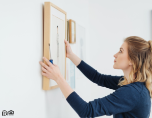 Norwalk Tenant Hanging Artwork in Their New Home