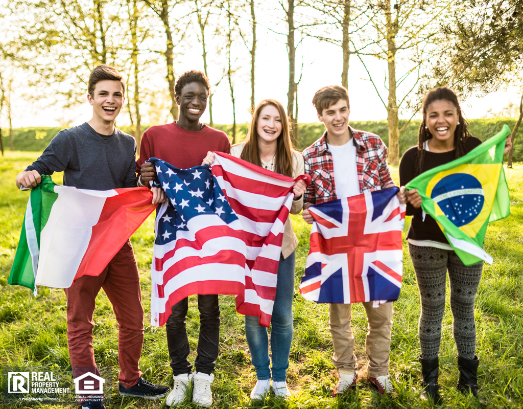 International Students Holding the Flags of their Respective Countries