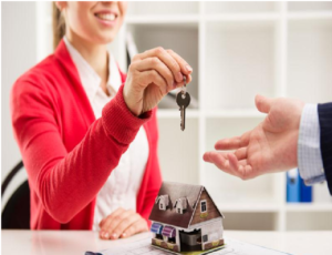Property Manager Handing Keys to a New Resident