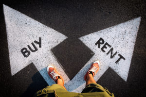 image of a person standing on two white arrows pointing at a 45 degree angle away from each other with the word buy in one and the word rent in the other