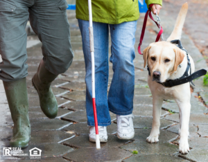 Blind person with her guide dog