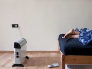 Gaithersburg Resident Warming Their Feet with a Space Heater