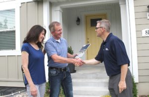 Property owner shaking hands with RPM Utah County property manager