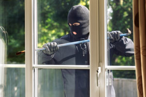 Robber Trying to Break into a House During Your Summer Vacation