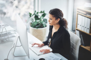 A Temecula rental investor working at a computer