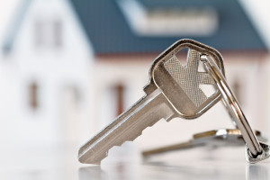 House Keys With Home In Background