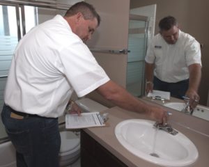 Checking the Bathroom Faucets During a Kingman Rental Property Assessment