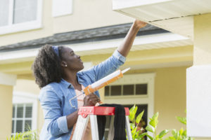 Woman Making Repairs to Her Rental Property in Golden Valley