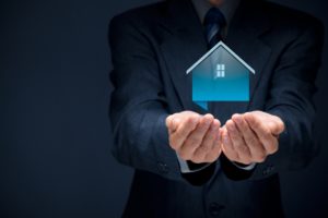 A Pair of Hands with a Floating House Icon Above Them