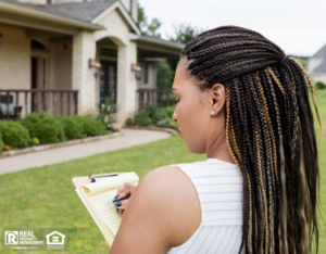 Woman writing her evaluation after doing a home inspection
