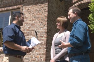 Property Manager Meeting with Property Owners to Asses their Rental Property