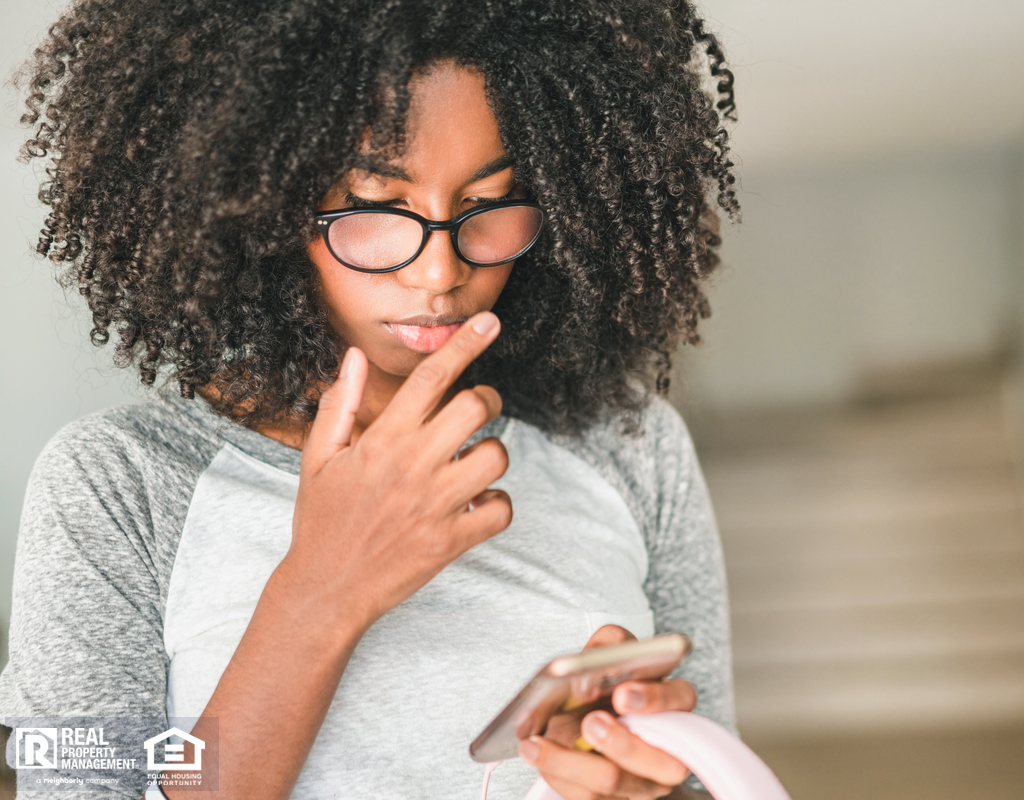 Young Woman Apartment Hunting on Her Phone