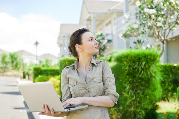 Real Estate Investing, woman looking at property