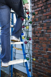 West Bend Tenant Hanging Christmas Lights for the Holiday Season