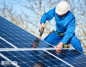 Electrician Installing Solar Panels on Roof of Rental Property