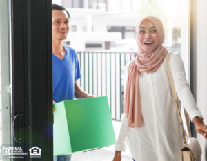Excited couple opening the door to their new rental