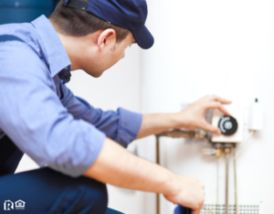 Man Fixing a Water Heater in Southern Maryland Rental Property