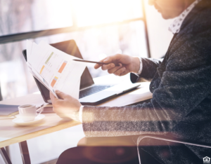 Cambridge Man Looking at Investment Portfolio