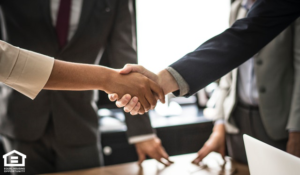 Two People Shaking Hands After a Successful Business Meeting