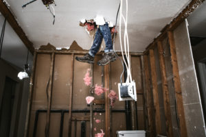 Contractor Man Doing Home Improvement and Demolition