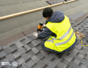 Handyman working on roofing repairs