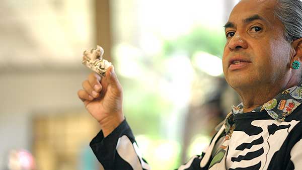 Man speaking at Día de los muertos event