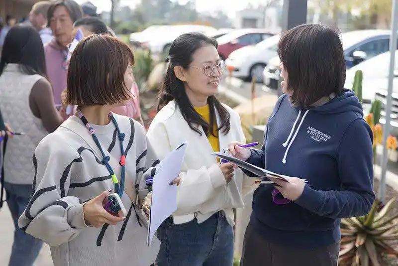 students and staff talking