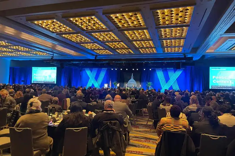 an auditorium with people seated