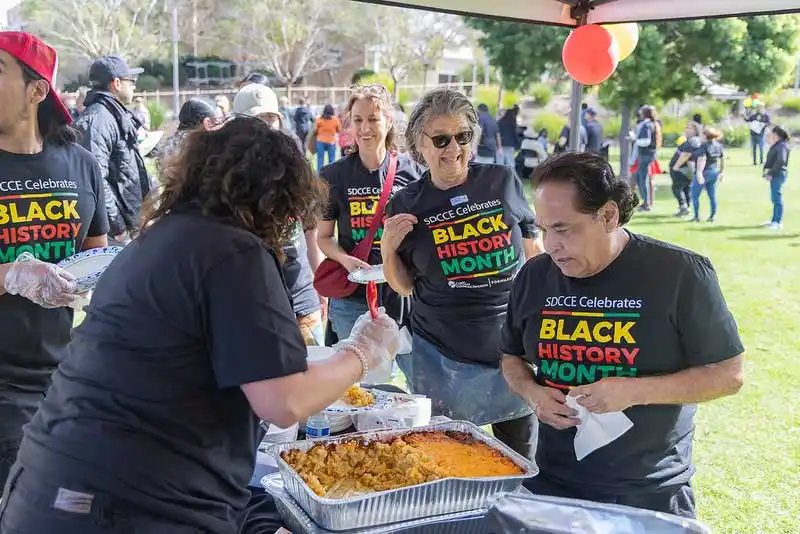people in line for a buffet