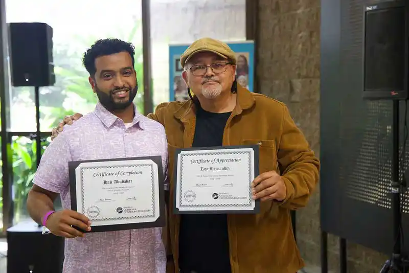 2 faculty members with certificates'