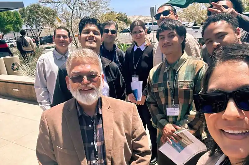 professor and group of skilled & Technical Trades students