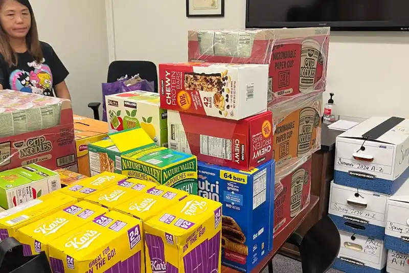 cares staff member and boxed food