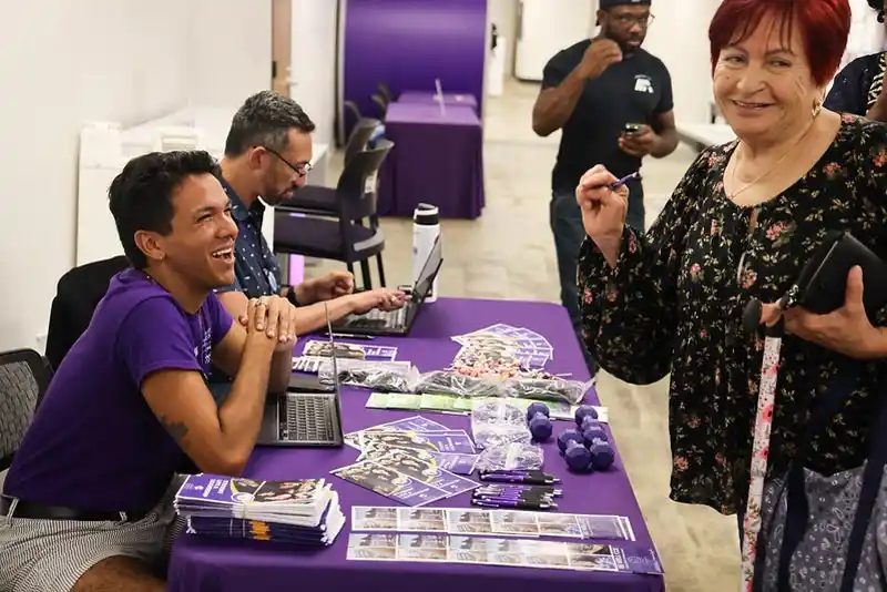 student being helped at table