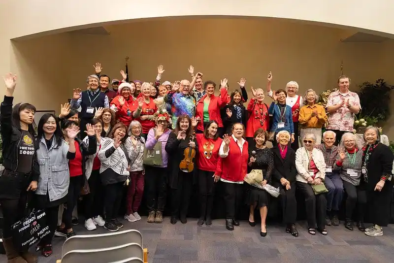 group of people waving