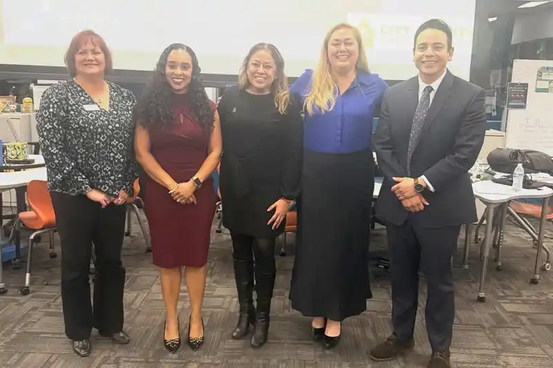 Tina King and 4 other people standing