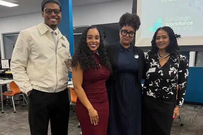 Tina King and 3 other people standing