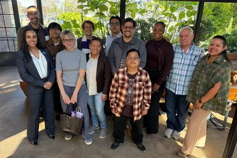 Tina King and 11 other people standing