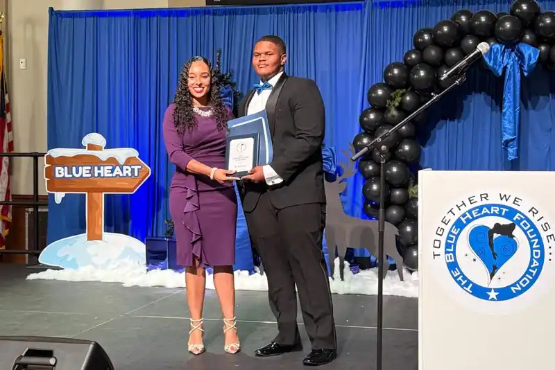 Tina King receiving an award