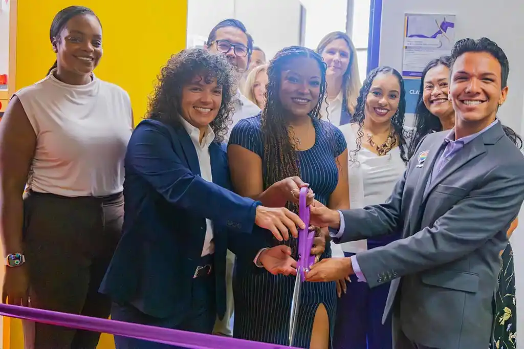 group of people with giant scissors