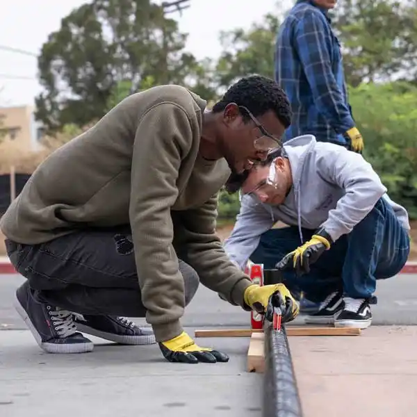 two people measuring and leveling