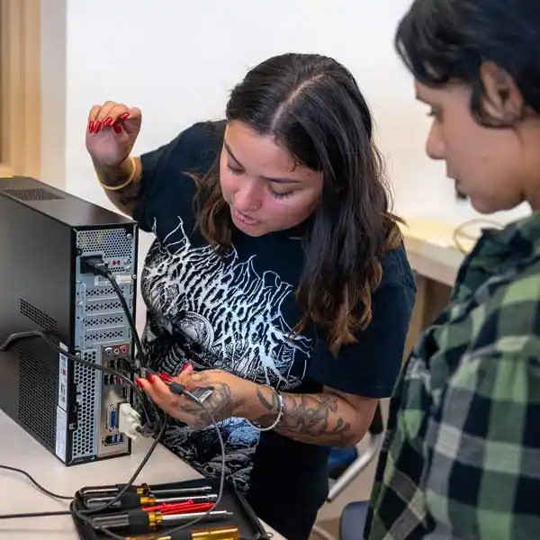two people working on a computer