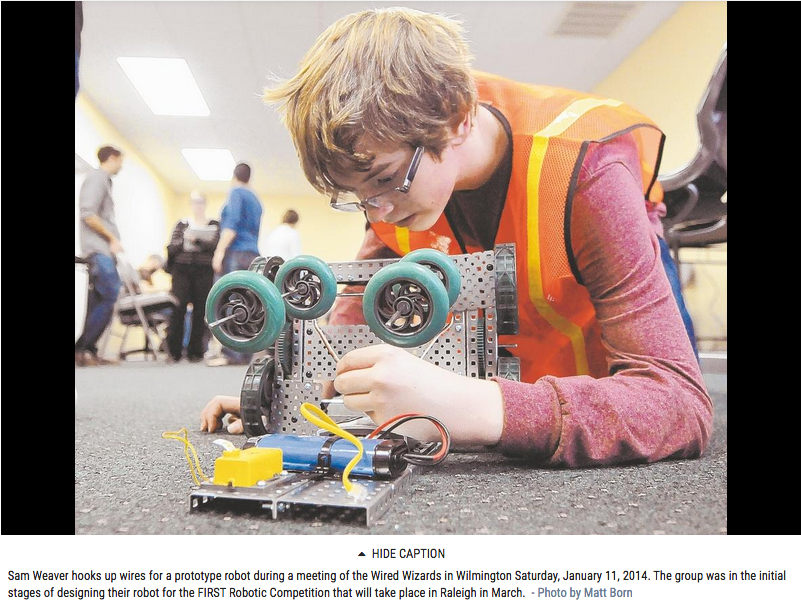 Wired Wizards member building a robot from the Wilmington Morning Star paper Wired Wizards member building a robot from the Wilmington Morning Star paper