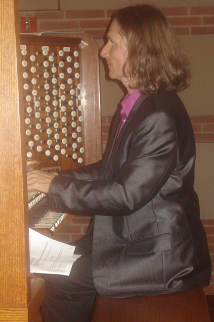 Christophe Bull, official organist at Royce Hall at UCLA, playing the Jupiter Symphony as the crowd keft the auditorium